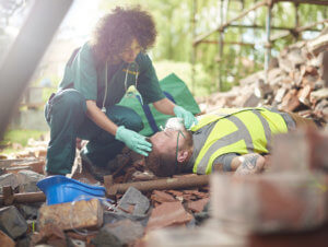 Nurse Giving Oxygen To Man Passed Out at Construction Site - Workers Compensation Attorneys - Martin, Harding & Mazzotti 1800law1010