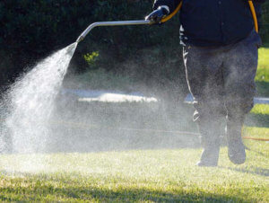 Grass Being Sprayed with Pesticides - Recalled Defective RoundUp Products - Defective Product Lawsuit