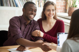 Couple speaking with a Workers' Compensation lawyer