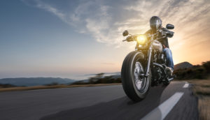 Motorcyclist driving down an open road