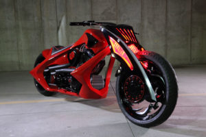 Unique custom black wheels and tires on a red concept motorcycle