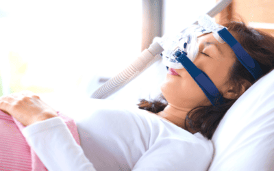woman sleeping using CPAP machine