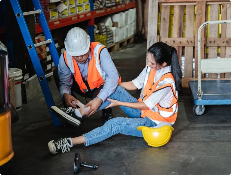 worker having ankled wrapped up after a fall