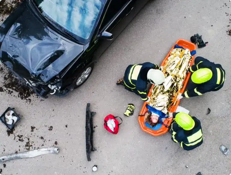 Paramedics attending to victim after car accident