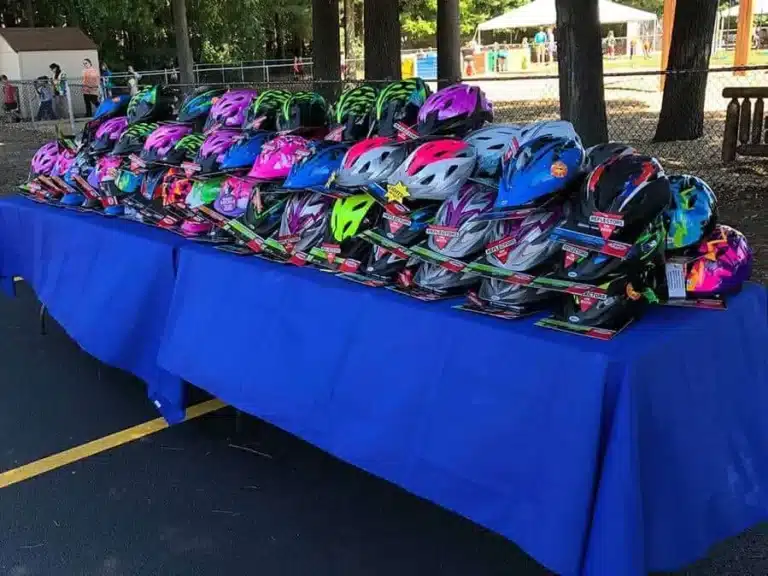 Table full of new bicycle helmets