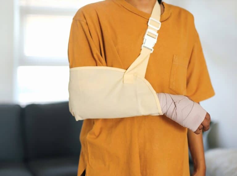 man with arm in sling