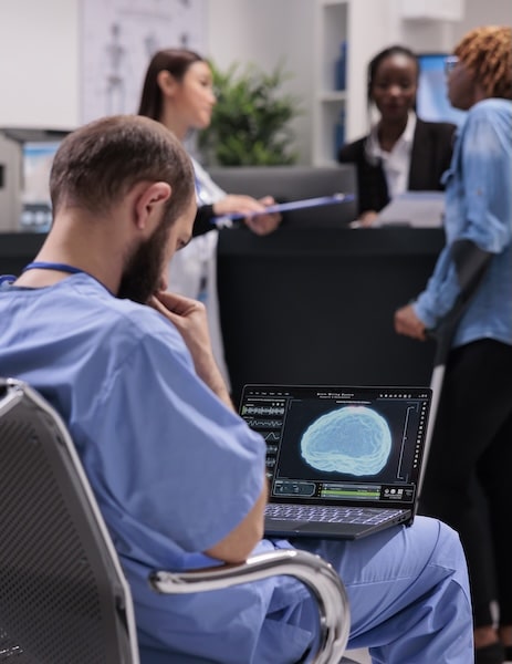 medical assistant reviewing scans
